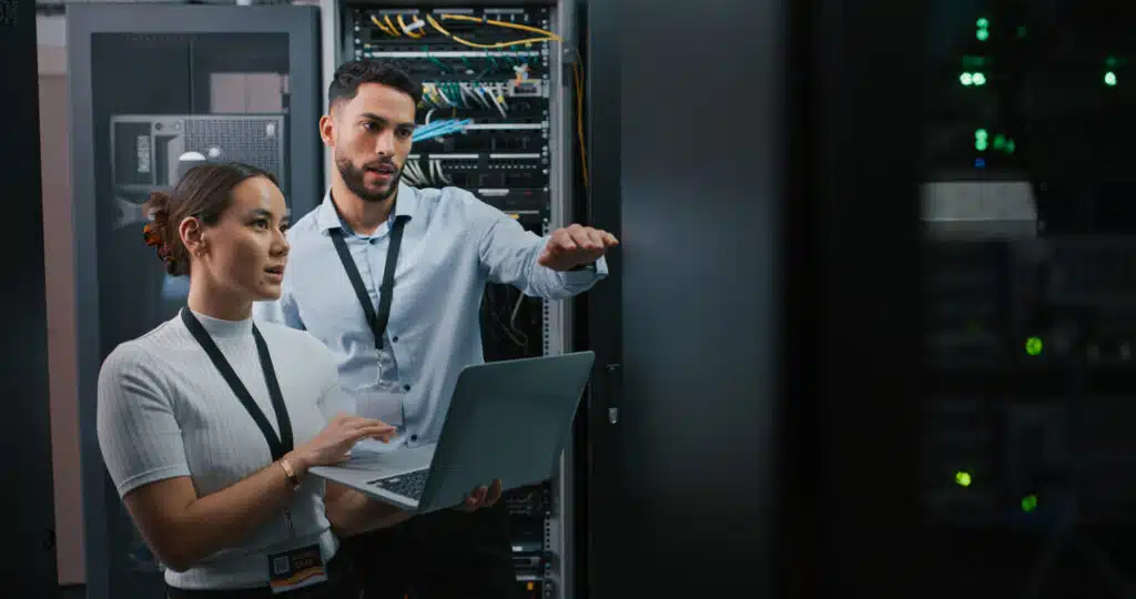 An IT team works on cloud-based legal tech in a law firm’s server room